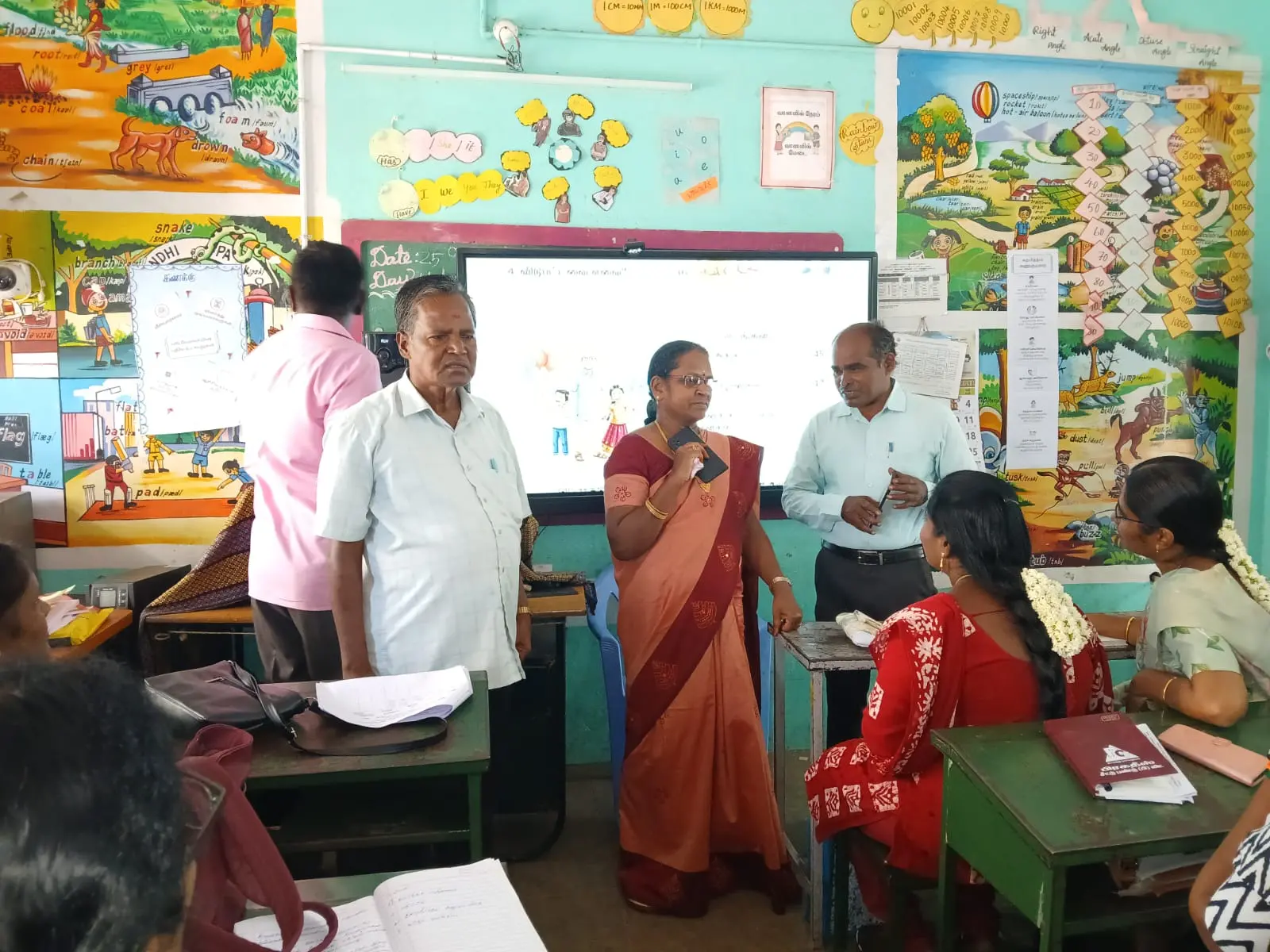 The Respected District Educational Officer (DEO) and visited the Block-Level New Textbook Training Programme for Classes 1 to 3 at Palacode Block and delivered t